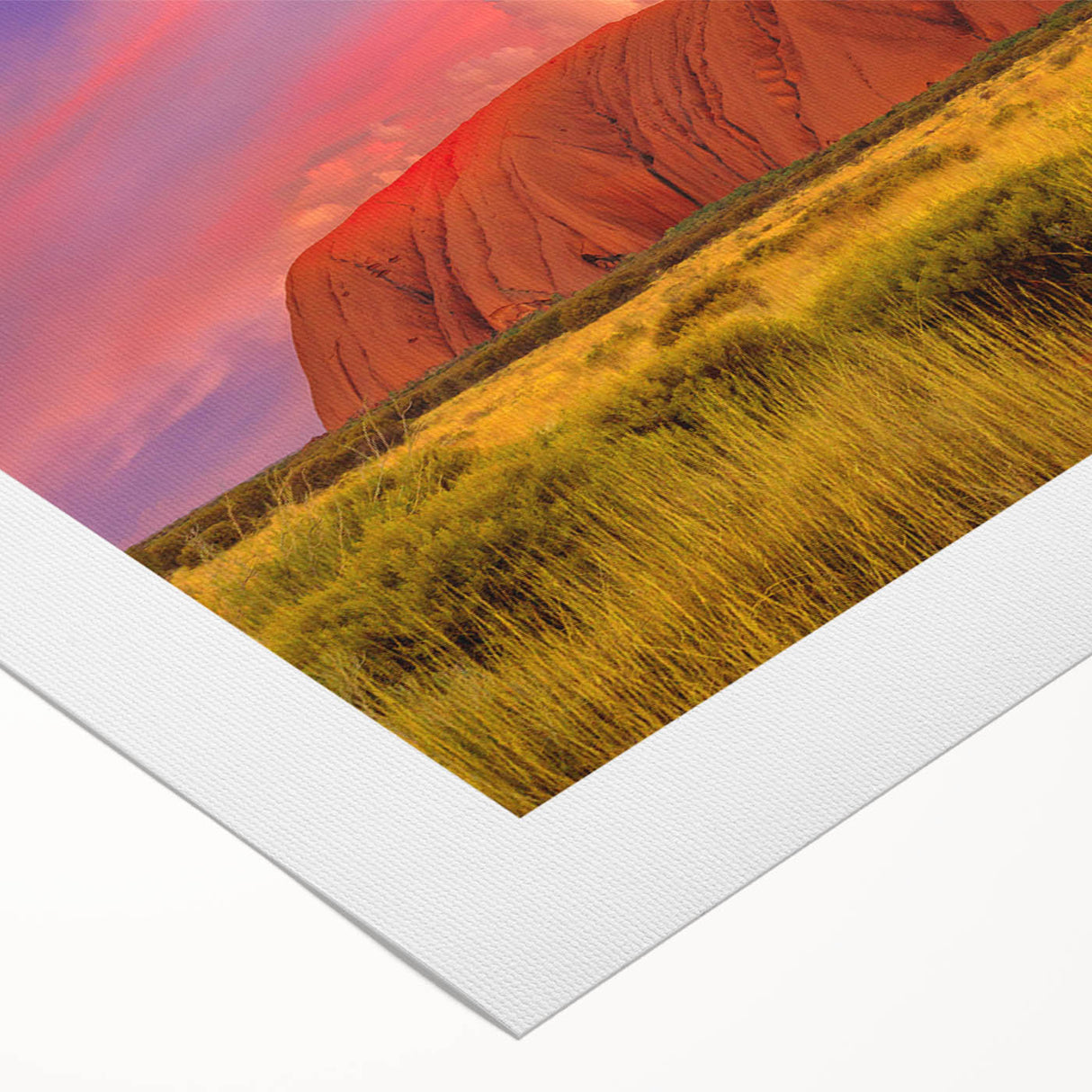Art deco poster of Ayers Rock in muted orange and brown tones on a rolled canvas, suitable for dining room decor.