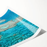 Extra large wall art depicting the Great Barrier Reef in vibrant oceanic blues and greens on a rolled canvas.