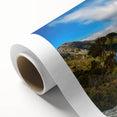 Art deco poster of Tasmania scenery in muted green and blue tones on rolled canvas, ideal for nursery wall art.
