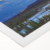 Art deco poster featuring a serene Saskatchewan landscape, rendered in soft green and blue tones on rolled canvas.