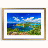 Abstract art print of Caribbean scenery in gold frame, featuring vibrant blue and green tones.