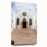 Large abstract wall art on acrylic glass depicting a Caribbean beach scene, with soft blue and sandy hues.