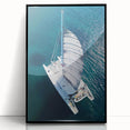 Large abstract wall art depicting a Caribbean seascape in vibrant blues and greens, framed in black acrylic.