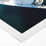 Art deco poster of a Caribbean scenery on rolled canvas, featuring vibrant blue and green tones.