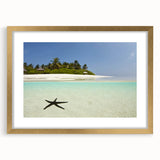 Abstract art print of a Caribbean landscape in gold frame, featuring muted blue and green tones, ideal for dining room decor.