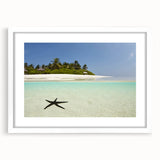 Textured abstract art print of a Caribbean seascape in serene blue tones, framed with a white mat.