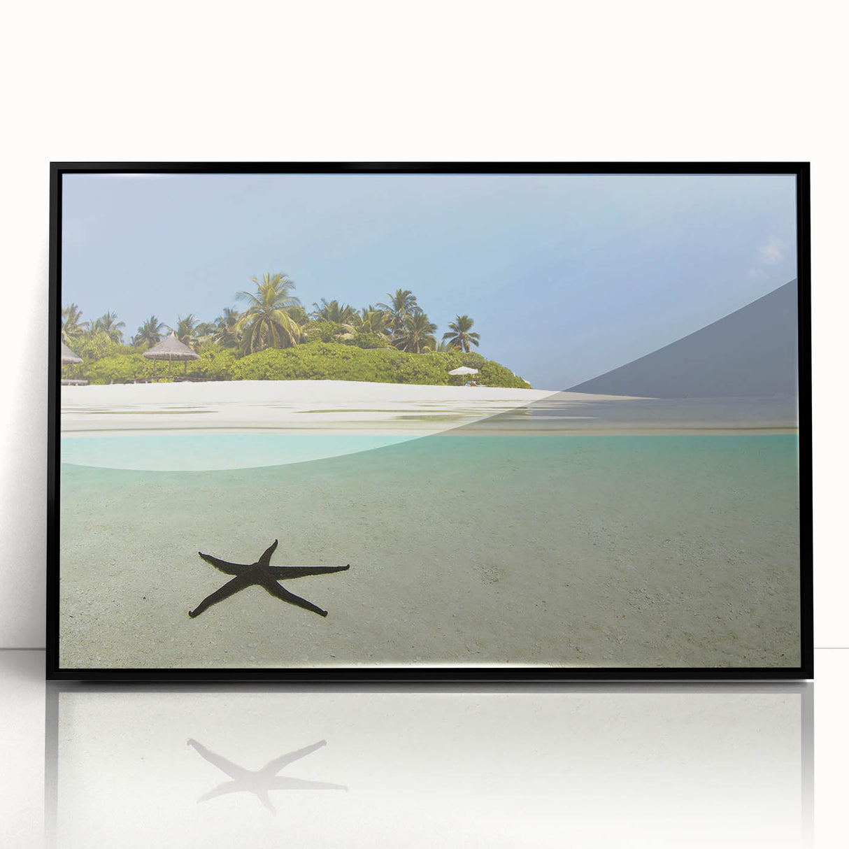 Large abstract wall art of a Caribbean seascape in muted blue and green tones on a framed acrylic.
