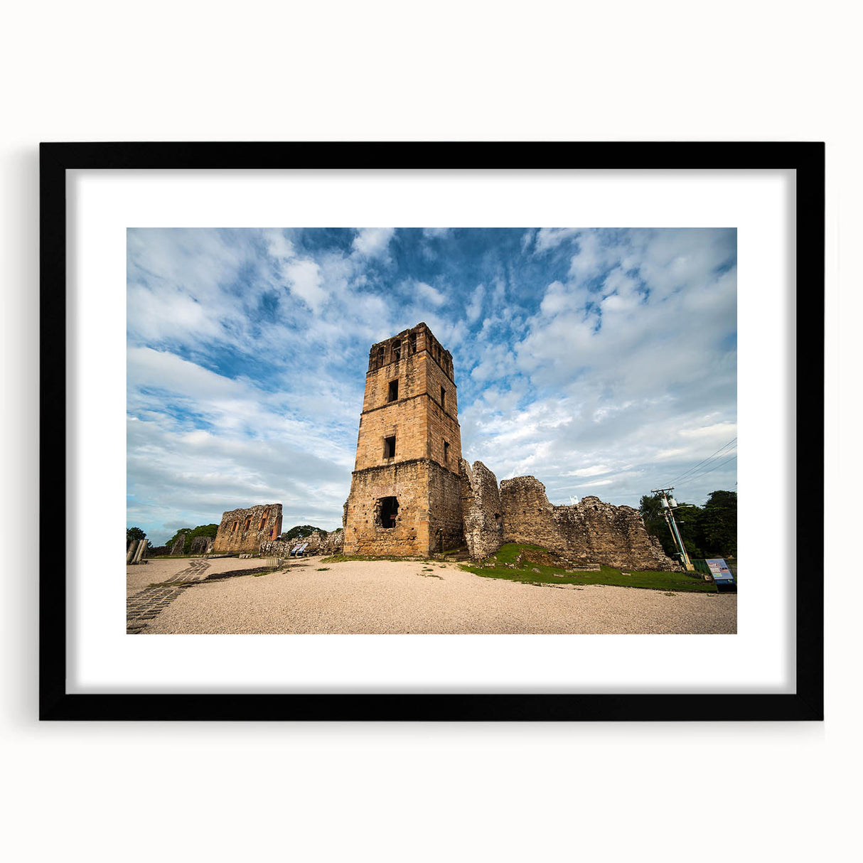 Extra large abstract art print of a colorful Central American scenery on a textured canvas, framed in black.
