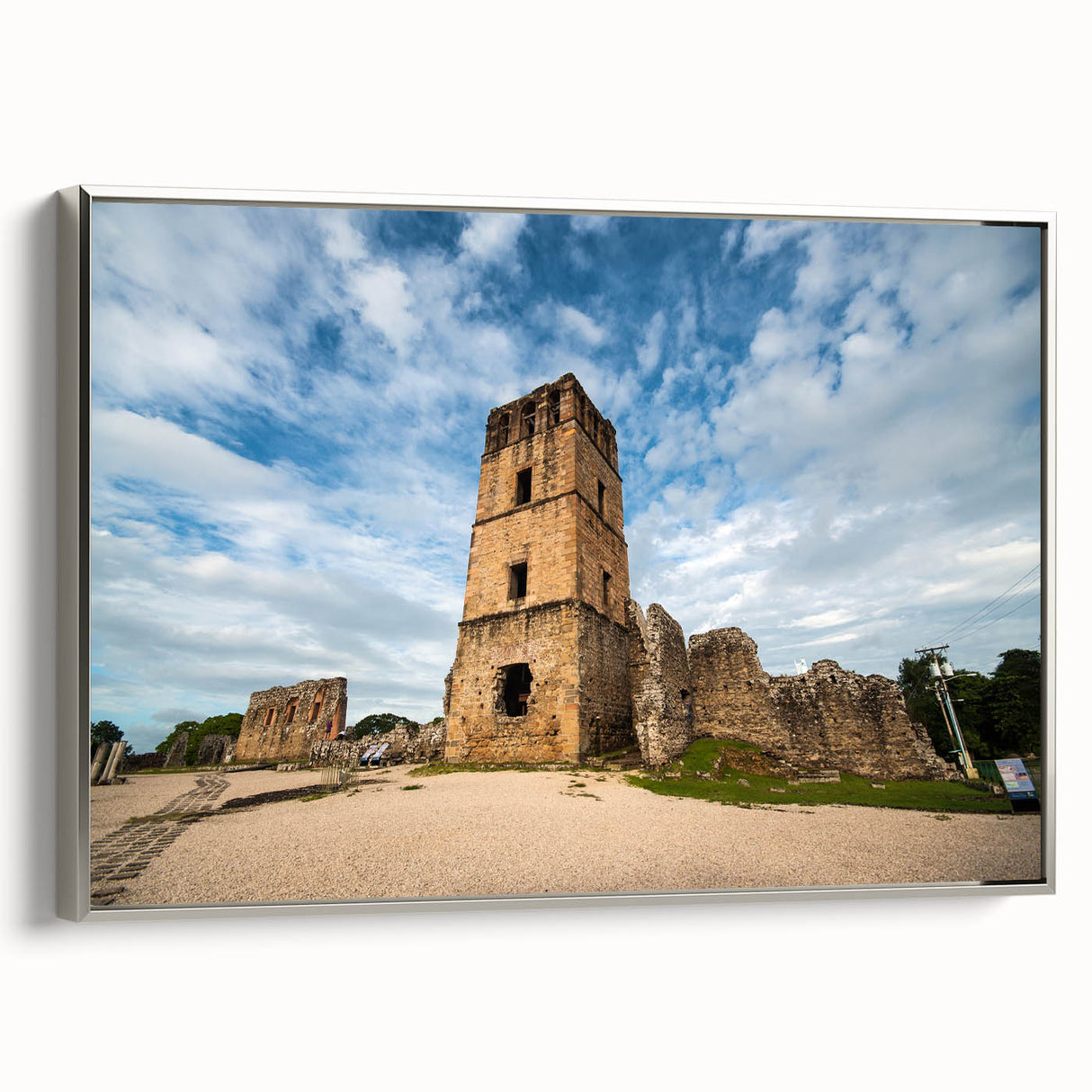 Framed canvas landscape art painting depicting a vintage Central American scene with vibrant colors on a black background.