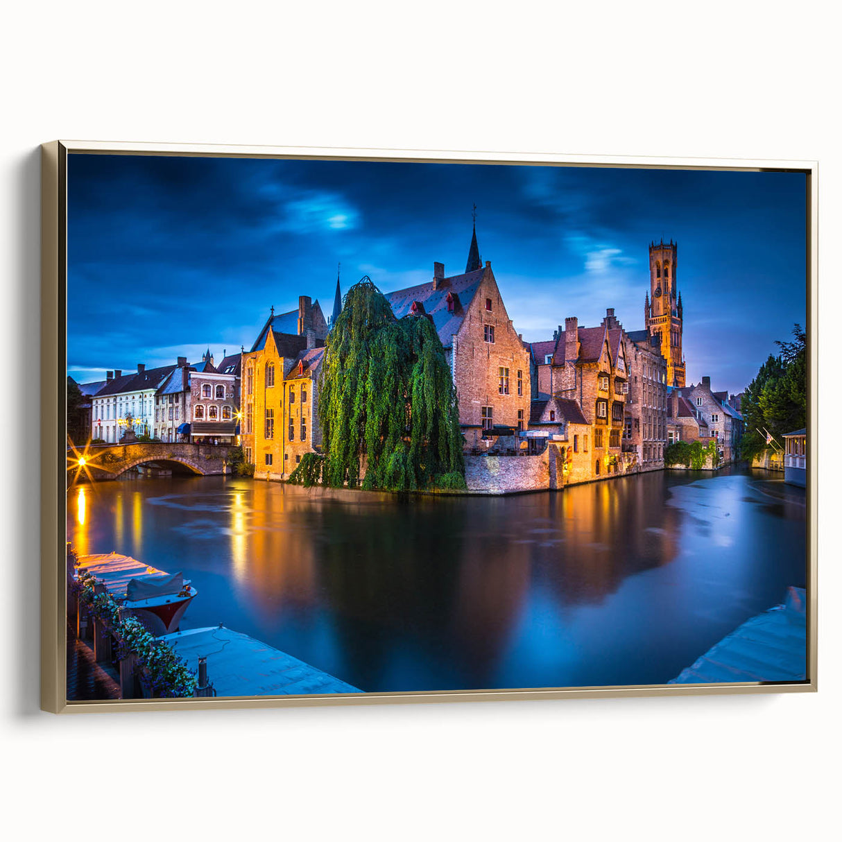 Framed canvas featuring a vintage-style landscape painting of a Belgian scenery in muted gold and black tones.
