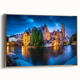 Framed canvas featuring a vintage-style landscape painting of a Belgian scenery in muted gold and black tones.