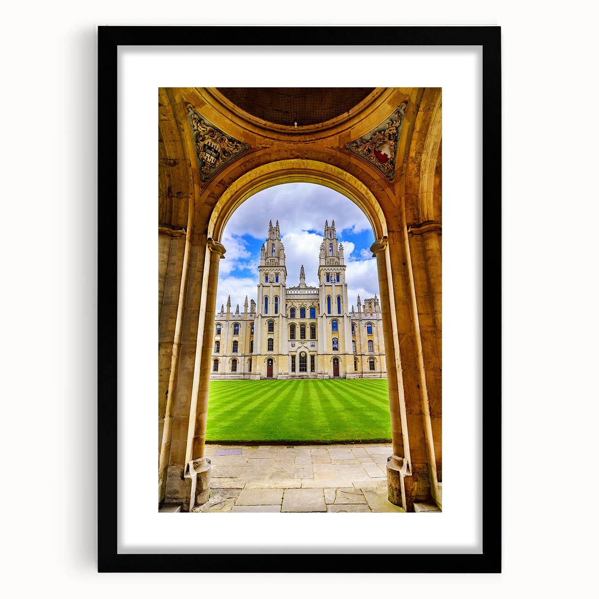 Colorful abstract art print of Oxford scenery in vibrant hues on textured canvas, framed in black.