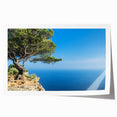 Rolled print of Provence scenery with lush floral foreground and soft pastel colors.