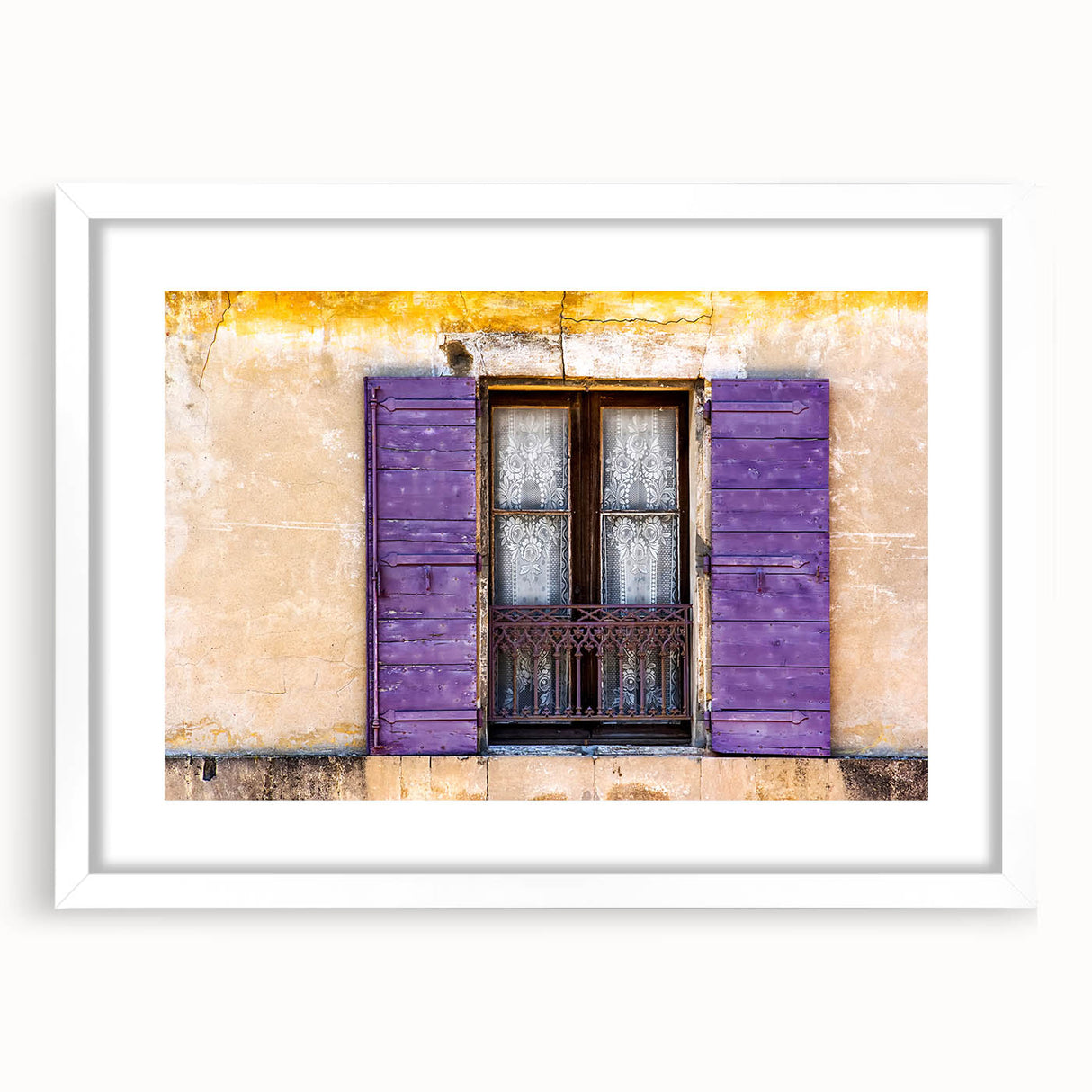 Textured art print depicting an abstract European scenery in muted earth tones, framed with a white mat.