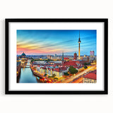 Abstract art print of a colorful European scenery in muted pastels on a textured, extra-large canvas, framed in black.