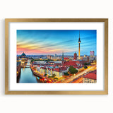 Abstract art print of a European scenery in muted green and blue tones, framed in gold, ideal for dining room decor.