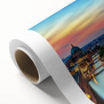 Art deco poster of a European scenery in muted green and brown tones on rolled canvas, ideal for nursery wall art.
