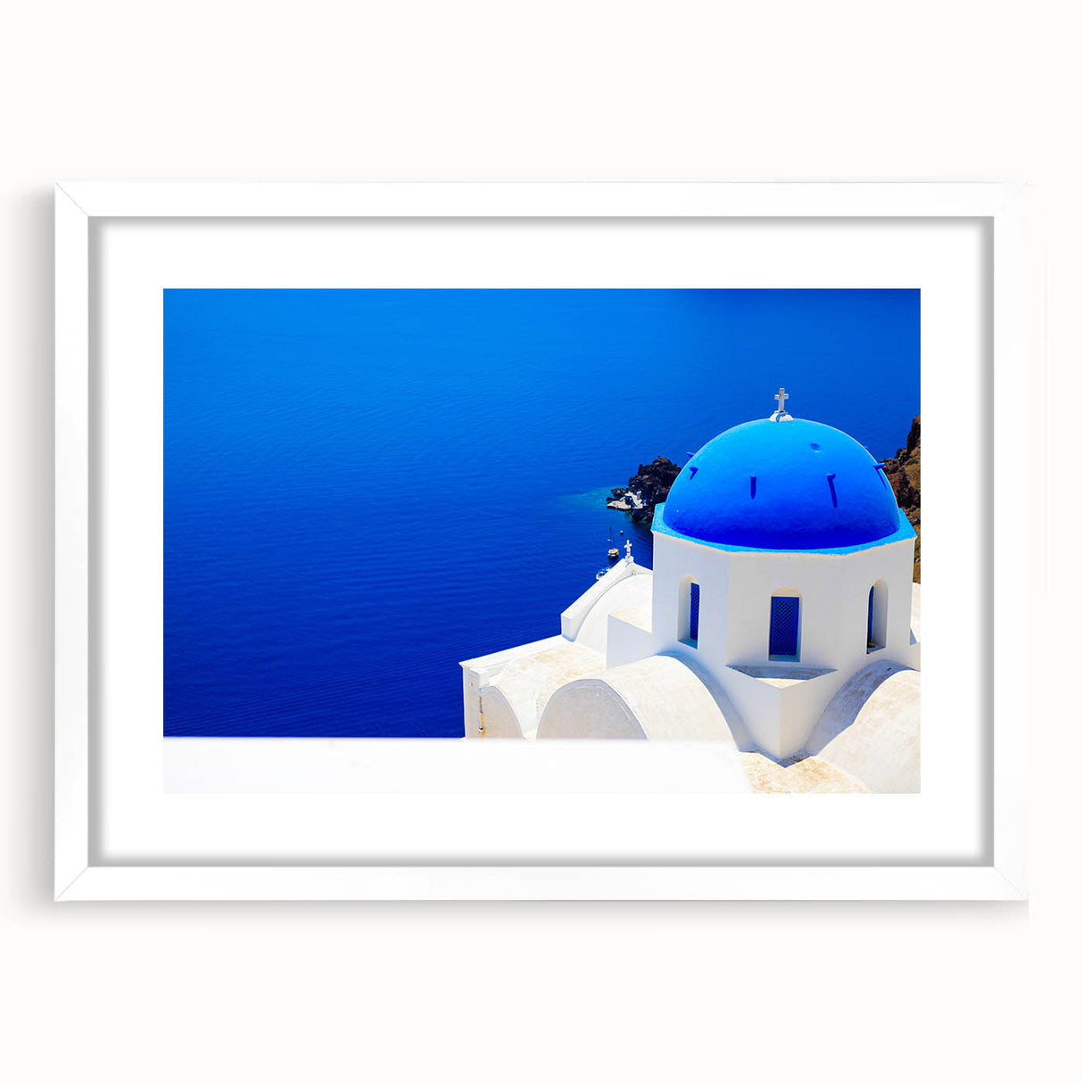 Textured art print of Santorini with abstract blue and white tones, framed in white, ideal for bedroom wall decor.