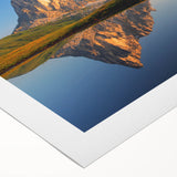 Art deco poster of the Dolomites in Italy, featuring a muted color palette on rolled canvas, suitable for dining room decor.