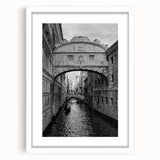 Textured art depicting an abstract Venice scenery in muted earth tones on a framed white mat, ideal for bedroom art.