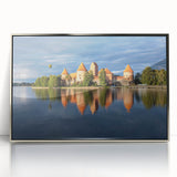 Large art print of a European Lithuanian scenery in muted earth tones, framed in silver acrylic.