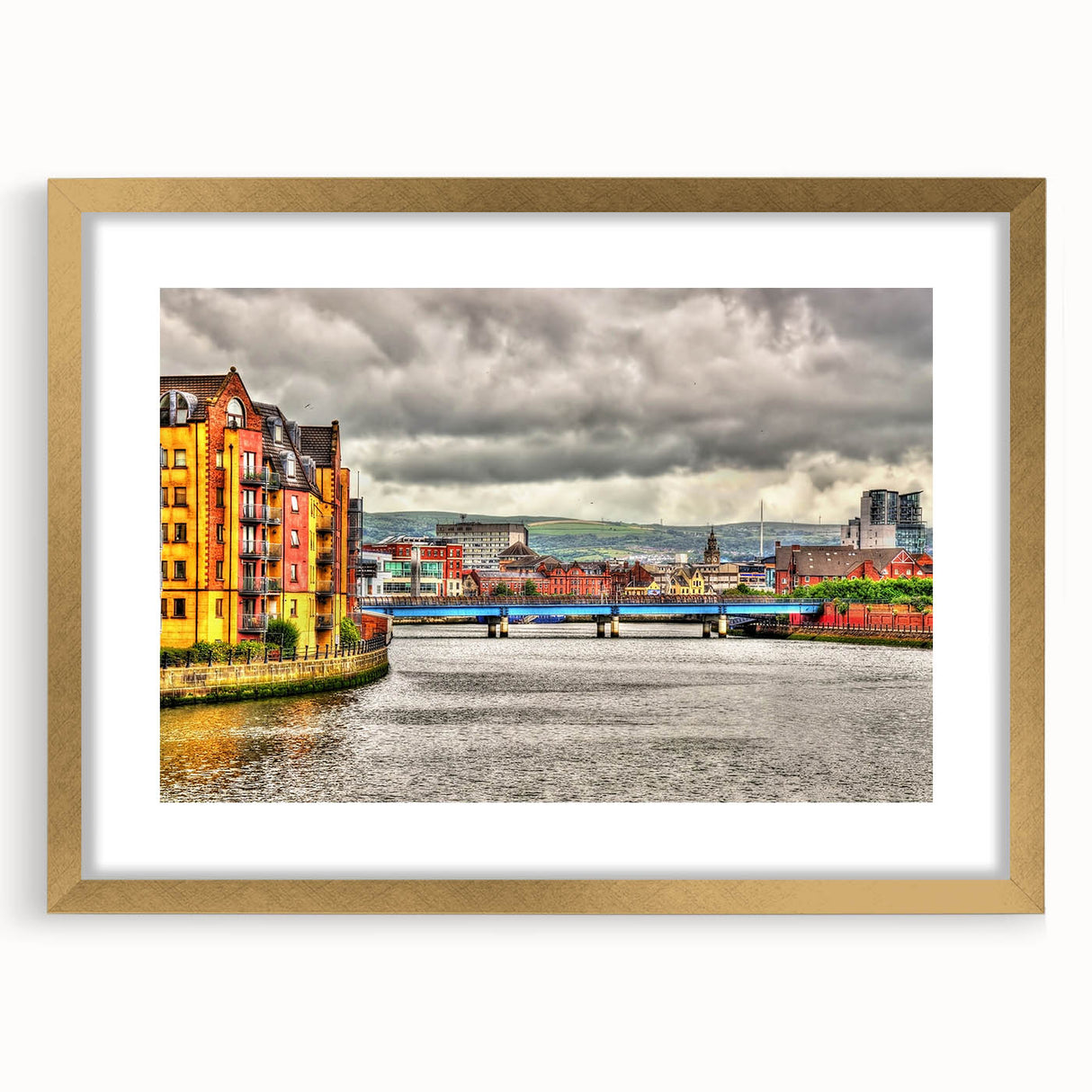Abstract art print of Northern Ireland scenery in muted green and blue tones, framed with a gold mat.