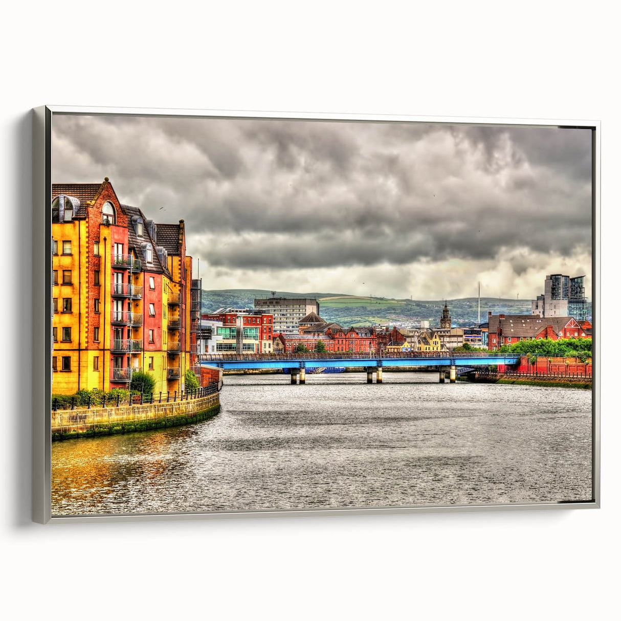 Framed canvas depicting a vintage landscape painting of Northern Ireland, featuring muted greens and blues.
