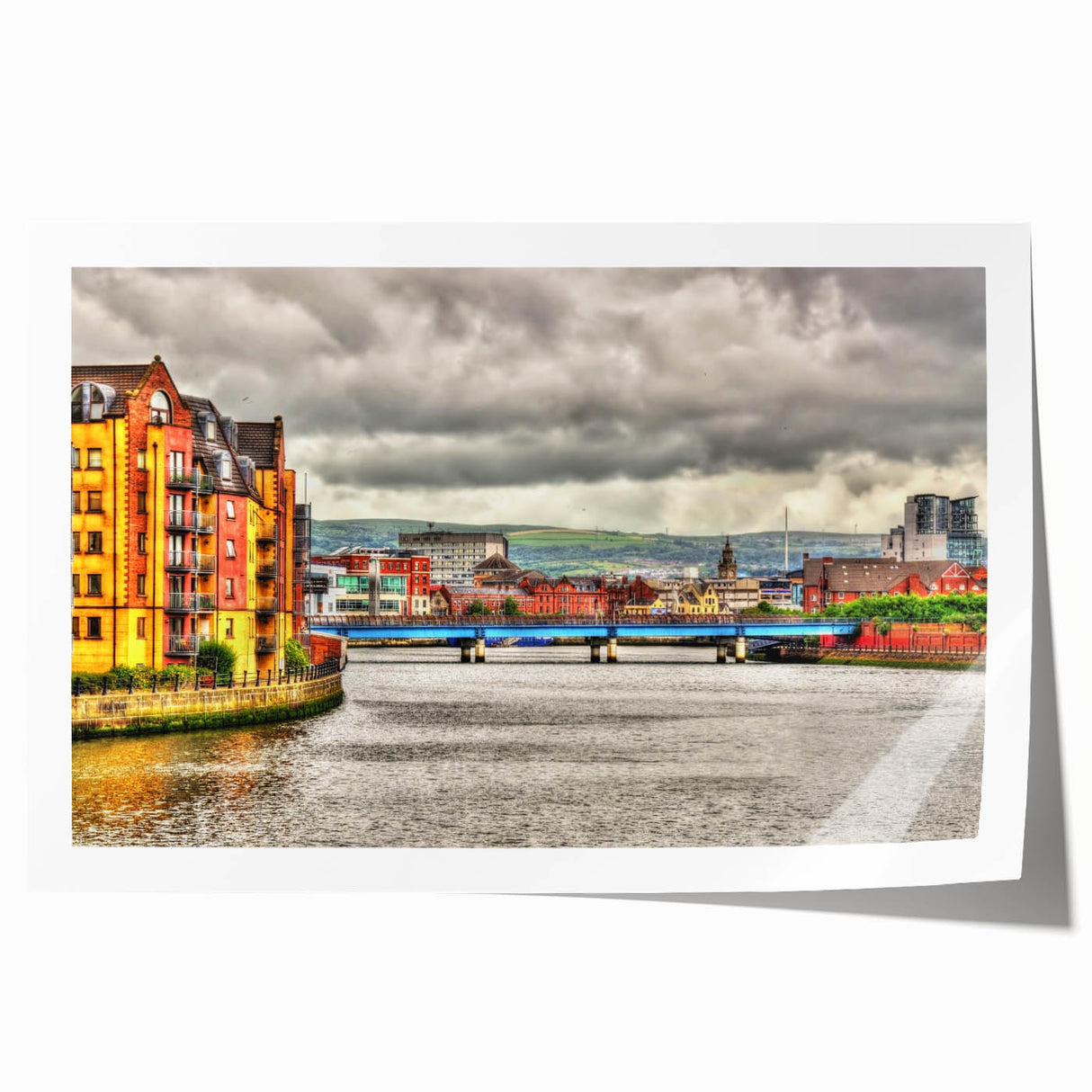 Rolled print depicting a serene Northern Ireland landscape with lush greenery and soft sky hues.