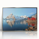 Large art print of a Norwegian landscape in muted green and blue tones, framed in silver acrylic.