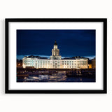 Abstract art print of a colorful, textured European cityscape on a large framed canvas, ideal for living room decor.
