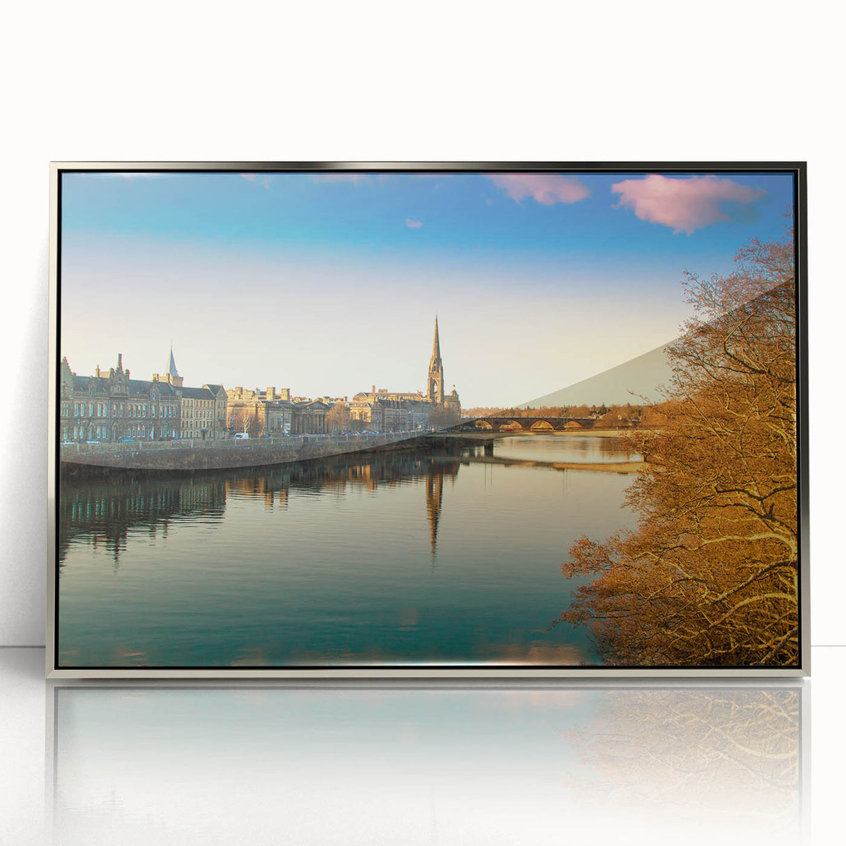 Large art print of a Scottish landscape in muted greens and blues on a silver-framed acrylic.