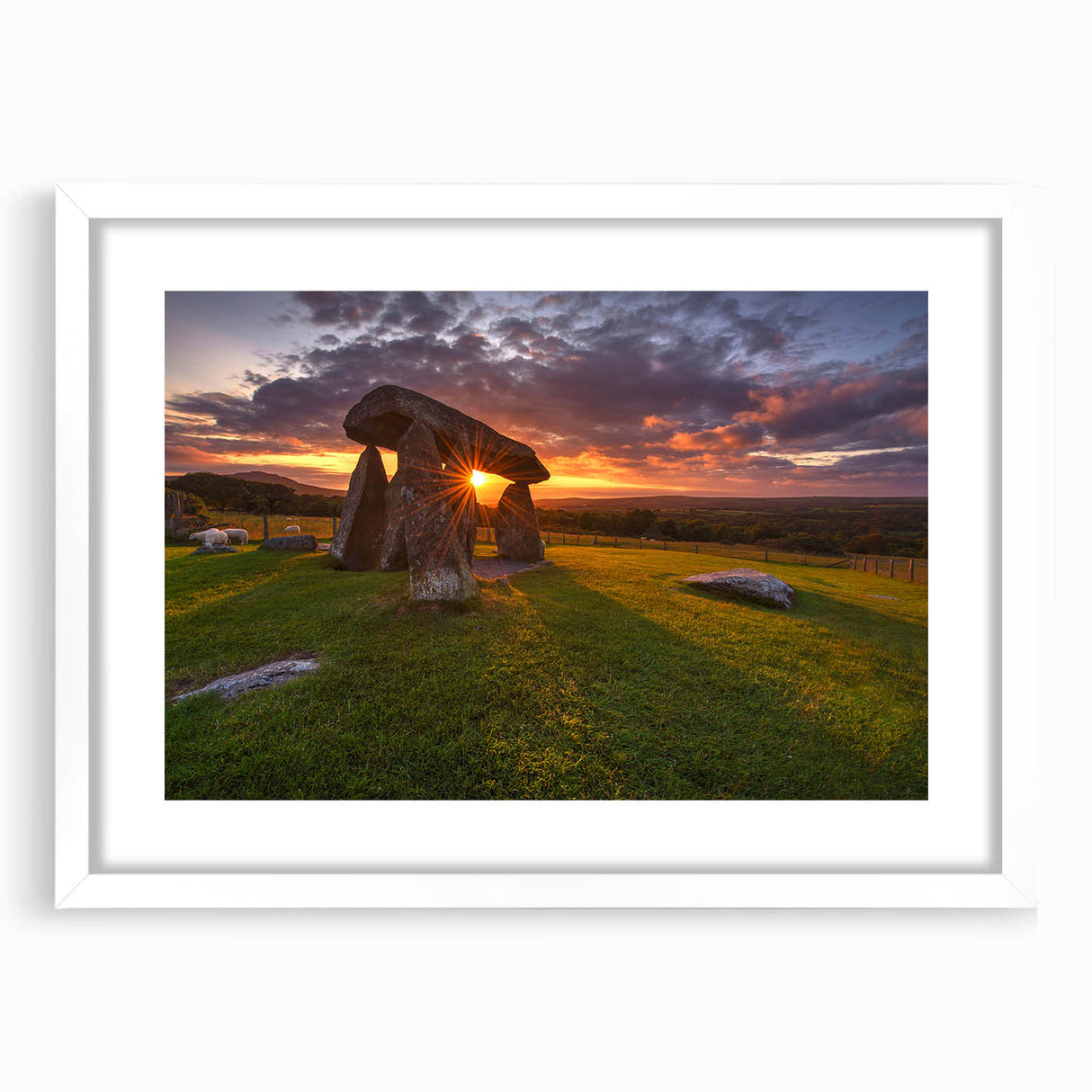 Abstract art print of a Welsh landscape in muted green and blue tones on a white framed canvas.