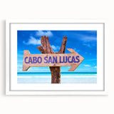 Abstract art print of Cabo San Lucas scenery in muted blue and white tones, framed with a white mat.