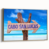 Framed canvas featuring a vintage-style landscape painting of Cabo San Lucas with a black and gold color scheme.