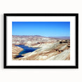 Abstract art print featuring a colorful, textured depiction of a Middle Eastern landscape on a large framed canvas.