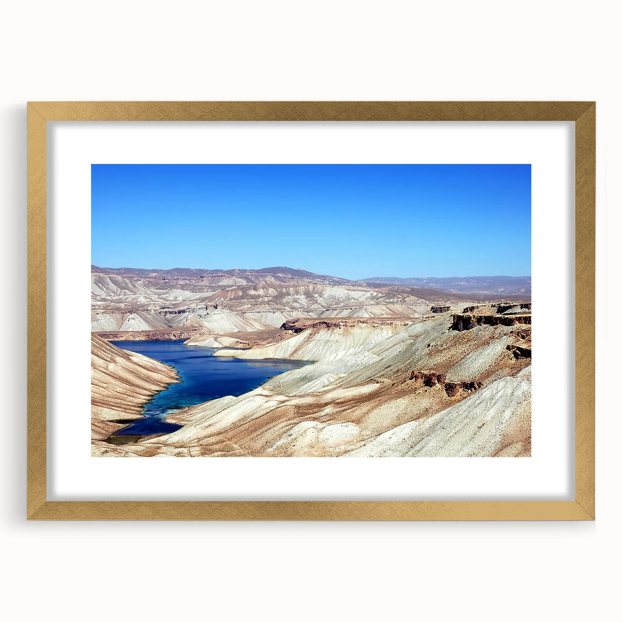 Extra large abstract art print depicting textured Middle Eastern scenery in muted gold tones, framed with a matte finish.