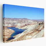 Large stretched canvas depicting a Middle Eastern landscape in muted earth tones, ideal for kitchen wall art.