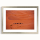 Textured abstract art print of a Middle Eastern scenery in muted earth tones, framed in silver, suitable for bedroom decor.