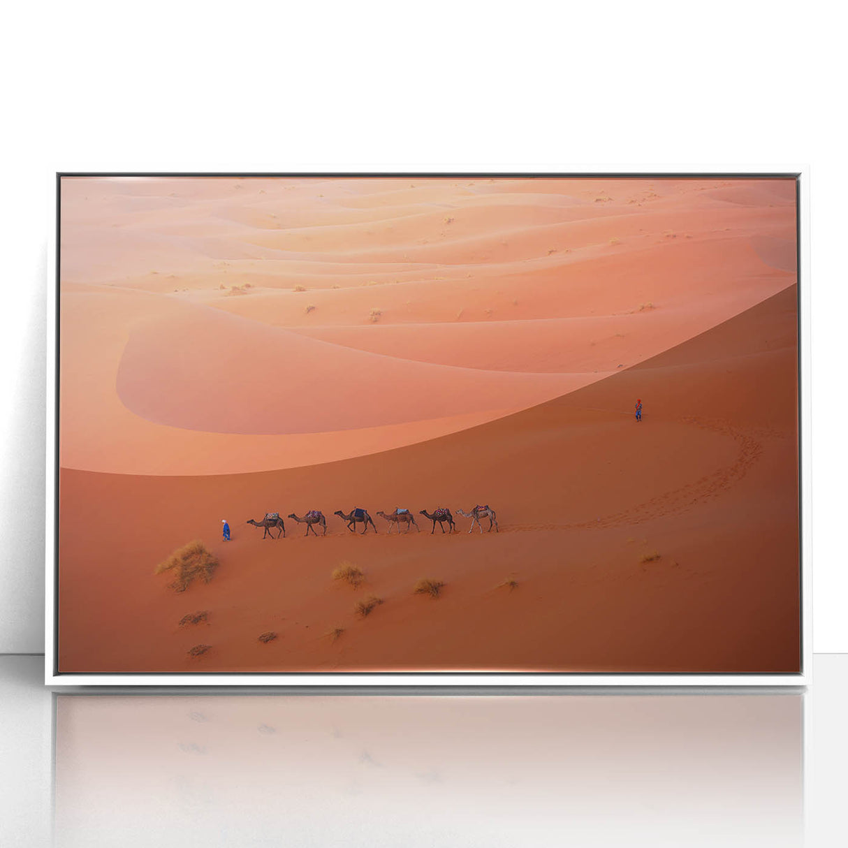 Acrylic print of a Middle Eastern landscape in muted colors, framed in white, suitable for modern nursery decor.