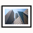 Extra large, colorful abstract art print of Tel Aviv skyline in vibrant hues on textured canvas, framed in black.