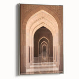Framed canvas featuring a landscape art painting of Oman scenery in vibrant colors on a black background.