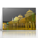 Art deco poster of a stylized Middle Eastern landscape in muted earth tones, framed in white acrylic.