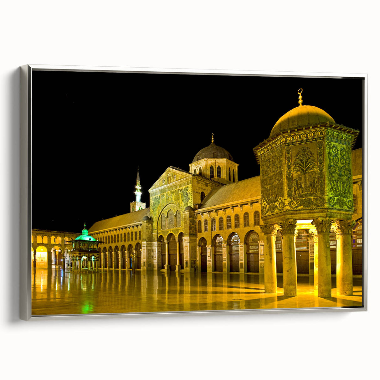 Framed canvas featuring a vintage-style landscape painting of a Middle Eastern scene in colorful tones.