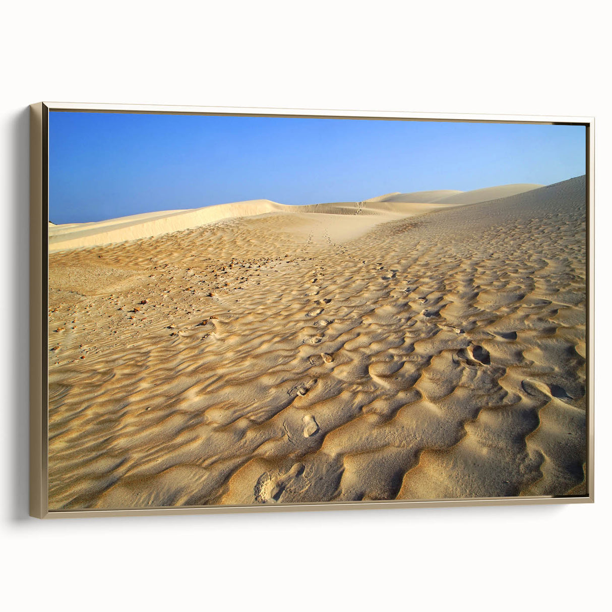Framed canvas featuring a vintage-style landscape painting of a Middle Eastern village, with muted earth tones.