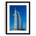 Colorful abstract art print of Burj Al Arab with vibrant hues on textured canvas, ideal for living room decor.