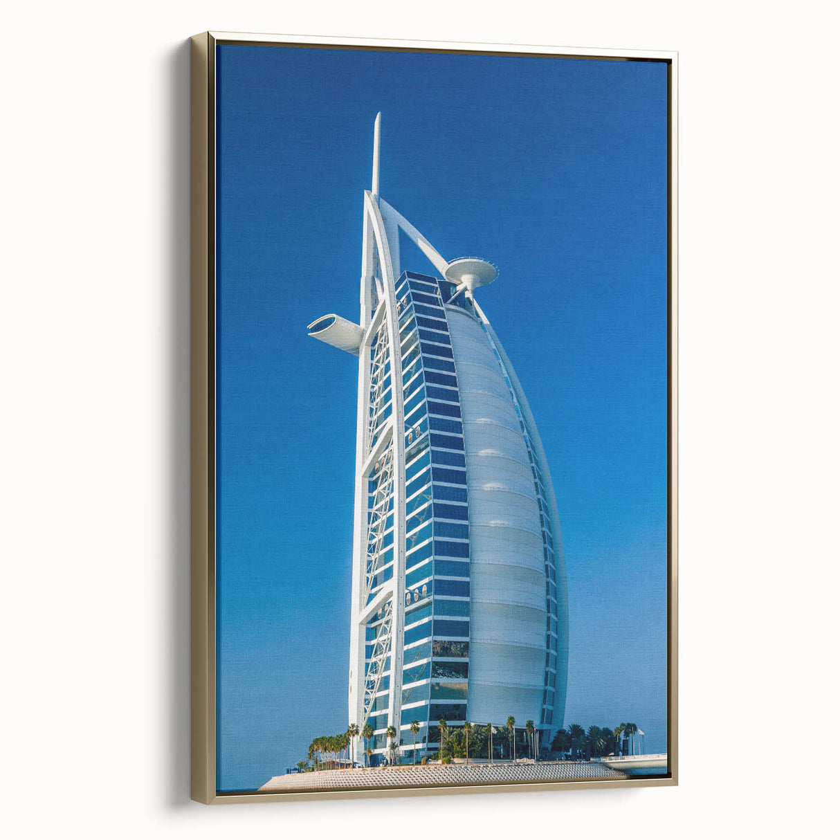 Framed canvas wall art featuring the Burj Al Arab with a vintage poster style in black and gold tones.