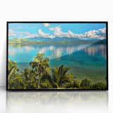 Large abstract wall art depicting an oceanic Fiji landscape in vibrant blues and greens, framed in black acrylic.