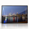 Large abstract wall art of Auckland’s skyline in muted blues and greys, framed in black acrylic.