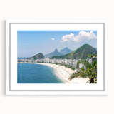 Abstract art print of a stylized Brazilian landscape in vibrant green and blue tones, framed with a white mat.