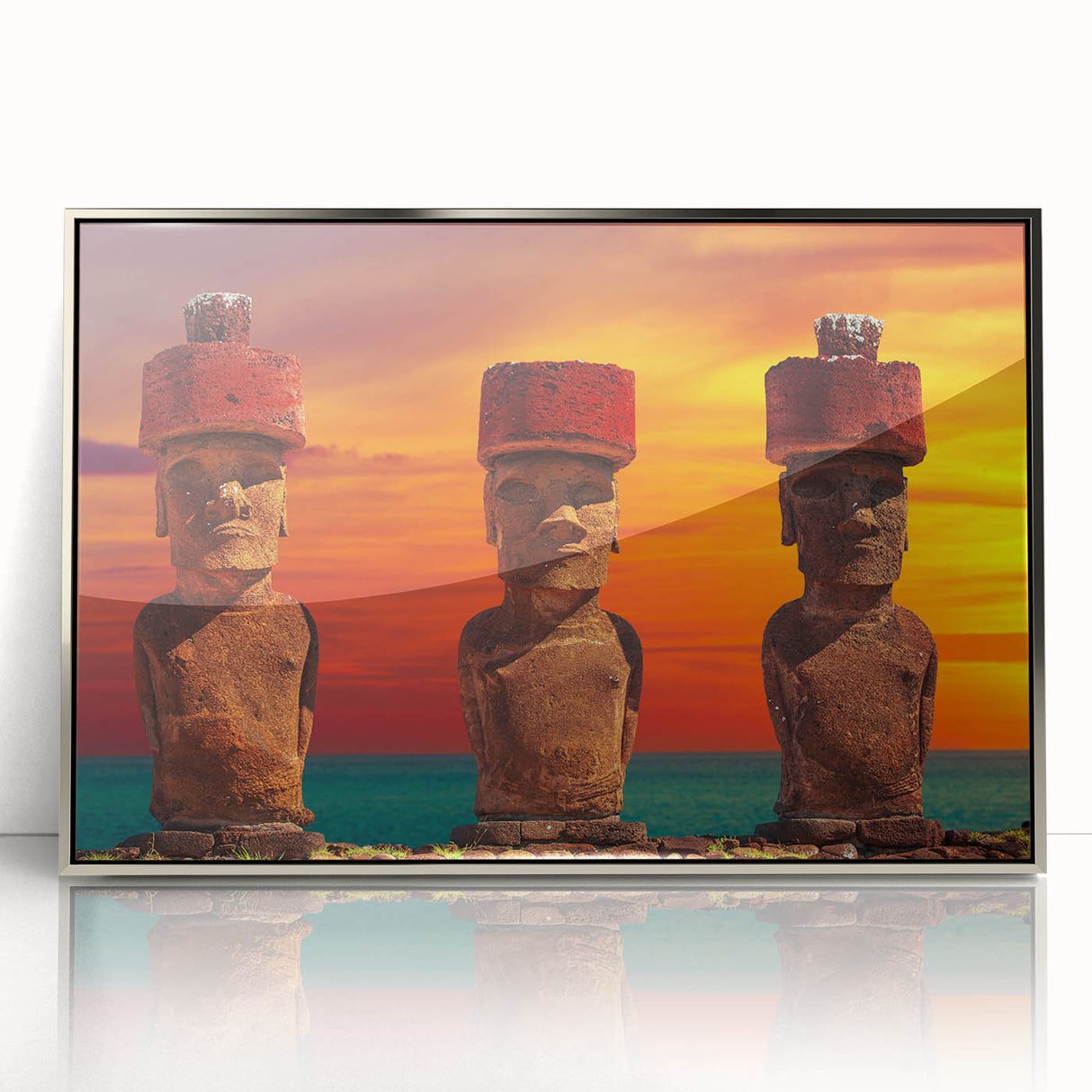 Mid-century modernist art depicting Easter Island statues in muted earth tones on a silver-framed acrylic print.